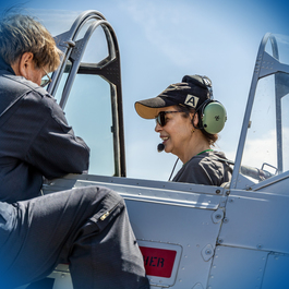 Passenger flying aboard a historic aircraft at Aviation Discovery Fest in Dallas