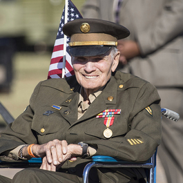 Military veteran speaking with visitors at Aviation Discovery Fest