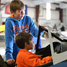 Kids participating in aviation STEM activities at Aviation Discovery Fest